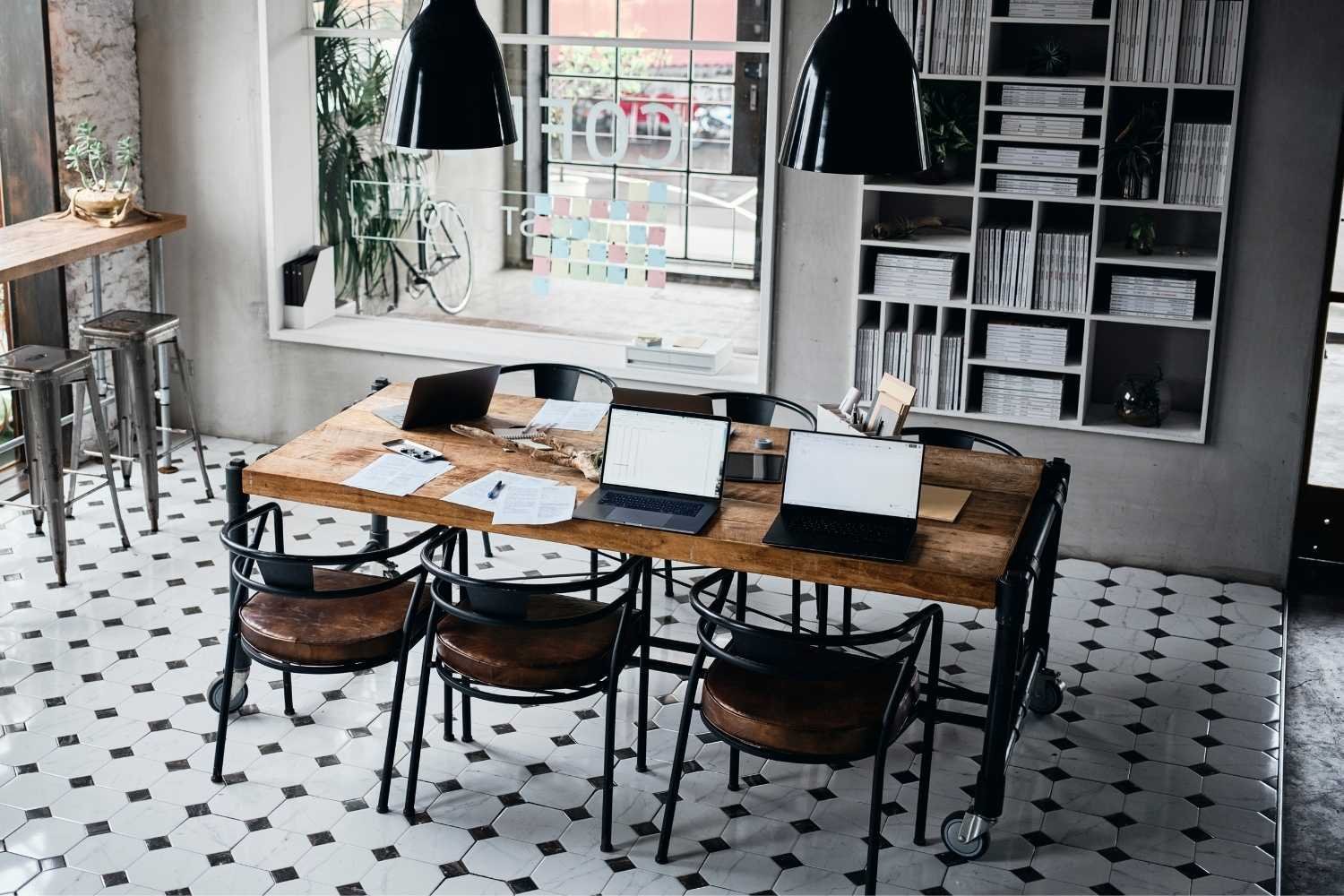 Infographic-style workspace with laptop + charts