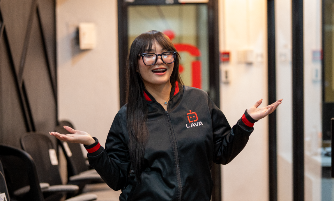 Lava automation's Virtual Assistant raising her hand on a lava jacket