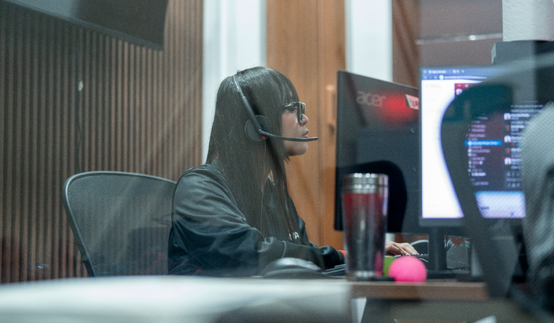 Lava Automations Virtual Assistant working on a computer while wearing a Headset