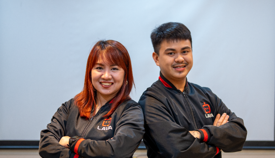 Two smiling lava virtual assistants crossing their hands while looking at the camera