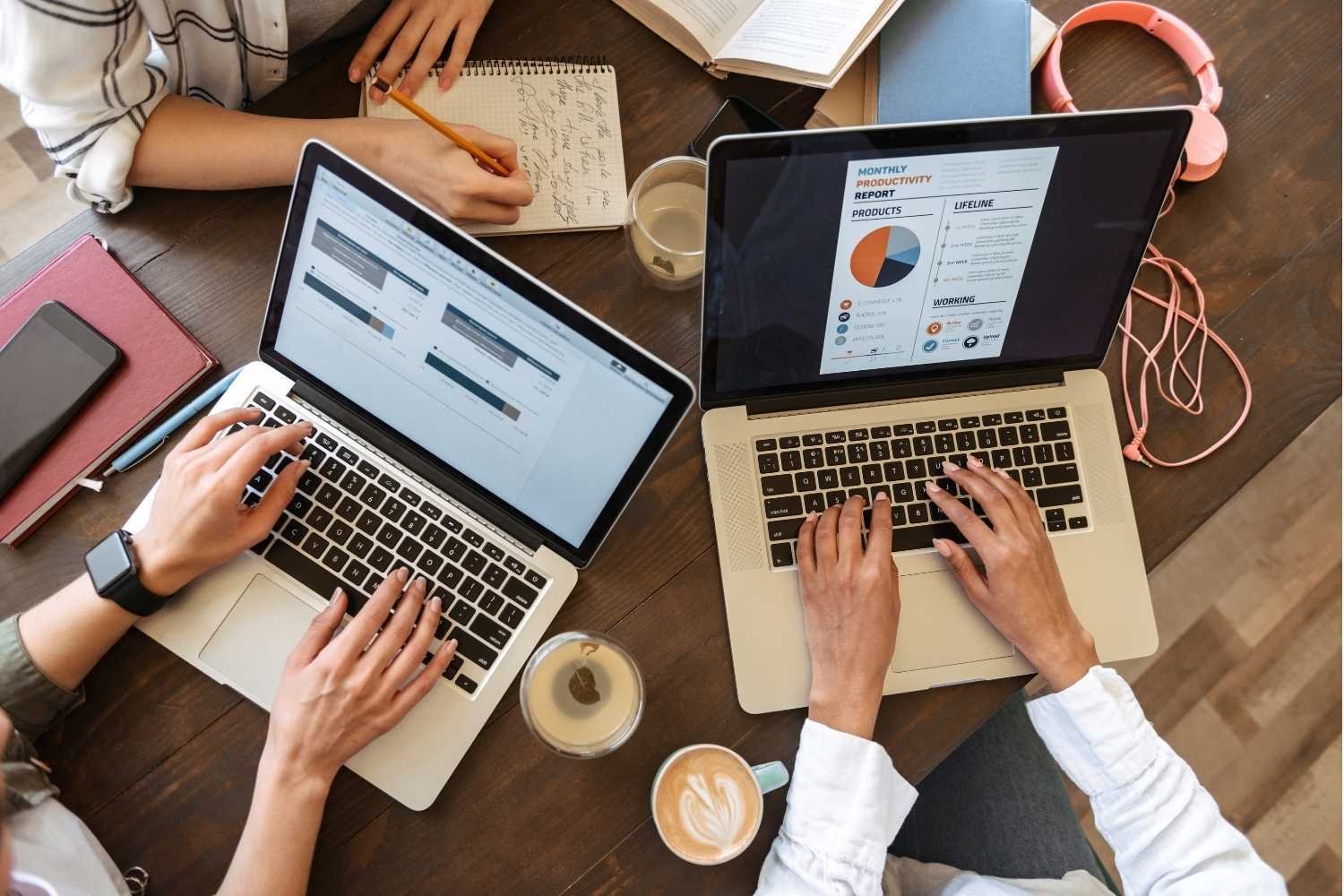 Women Typing on Laptop Computers