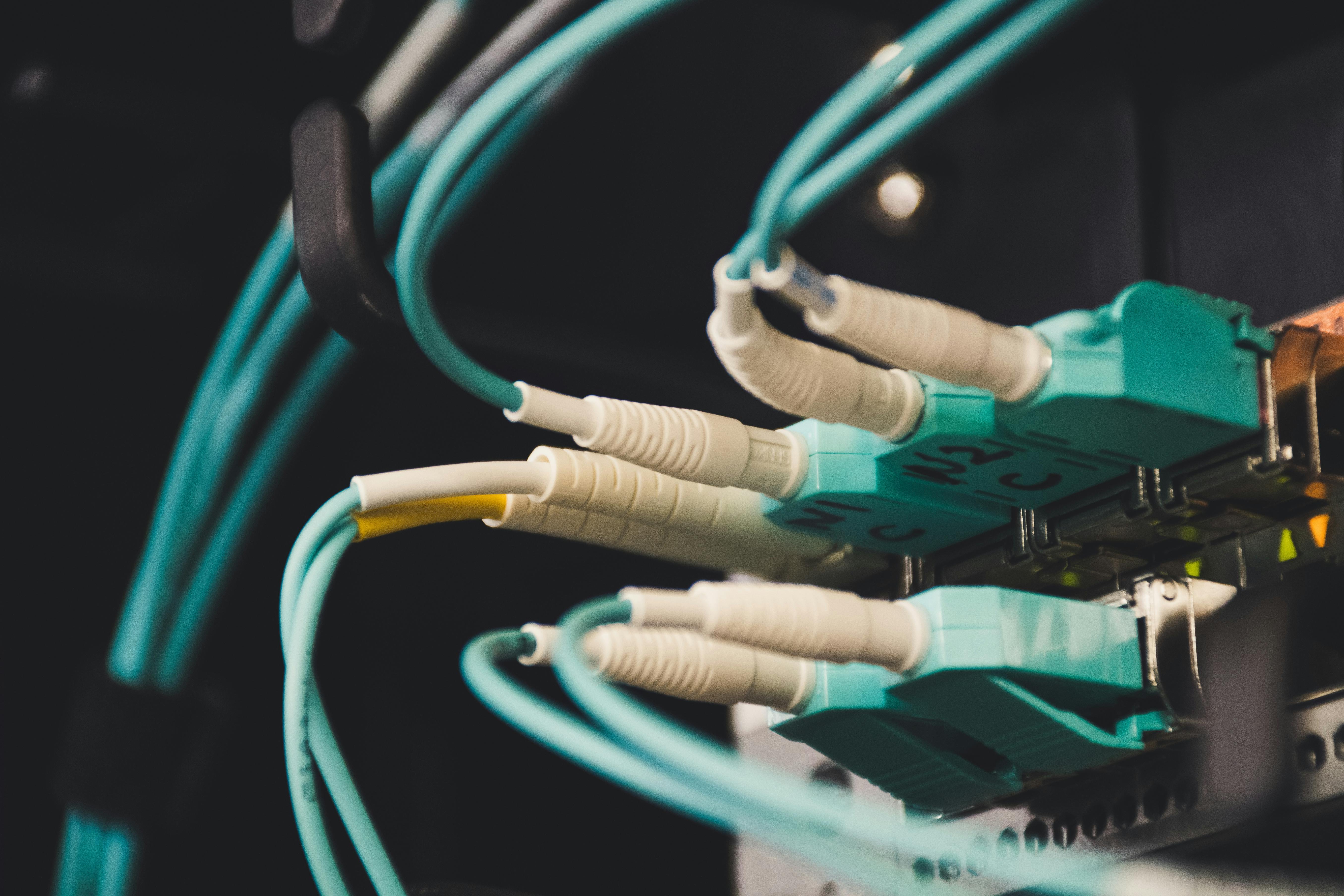 Close-up of network cables connected to a server representing tech stack integration